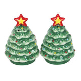 Two Christmas tree-shaped salt and pepper shakers with red stars on a white background