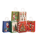 Set of Christmas-themed gift bags with nutcrackers and trees on a white background