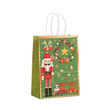 Christmas-themed gift bag with nutcracker, wreath, and train design on a green background.