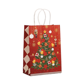Christmas-themed gift bag with a decorated tree and ornaments on a red background