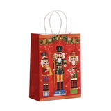 Red gift bag with nutcracker design on a white background
