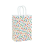 Paper git bags with colourful polka dots on white background